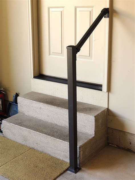 metal stair railing between house and garage|inside garage steps to house.